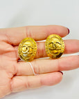 1990s CHANEL OVAL GOLD LOGO CLIP ON EARRINGS
