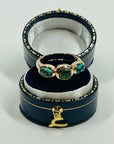 1970s 10K ROSE GOLD TRILOGY RING WITH EMERALD & PERIDOT CABOCHON