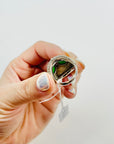 ANTIQUE SILVER RING WITH EMERALD CABOCHON AND FILIGREE DOME