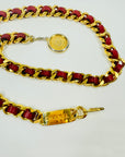 1980s CHANEL RED/BURGUNDY LEATHER GOLD PLATED LOGO BELT