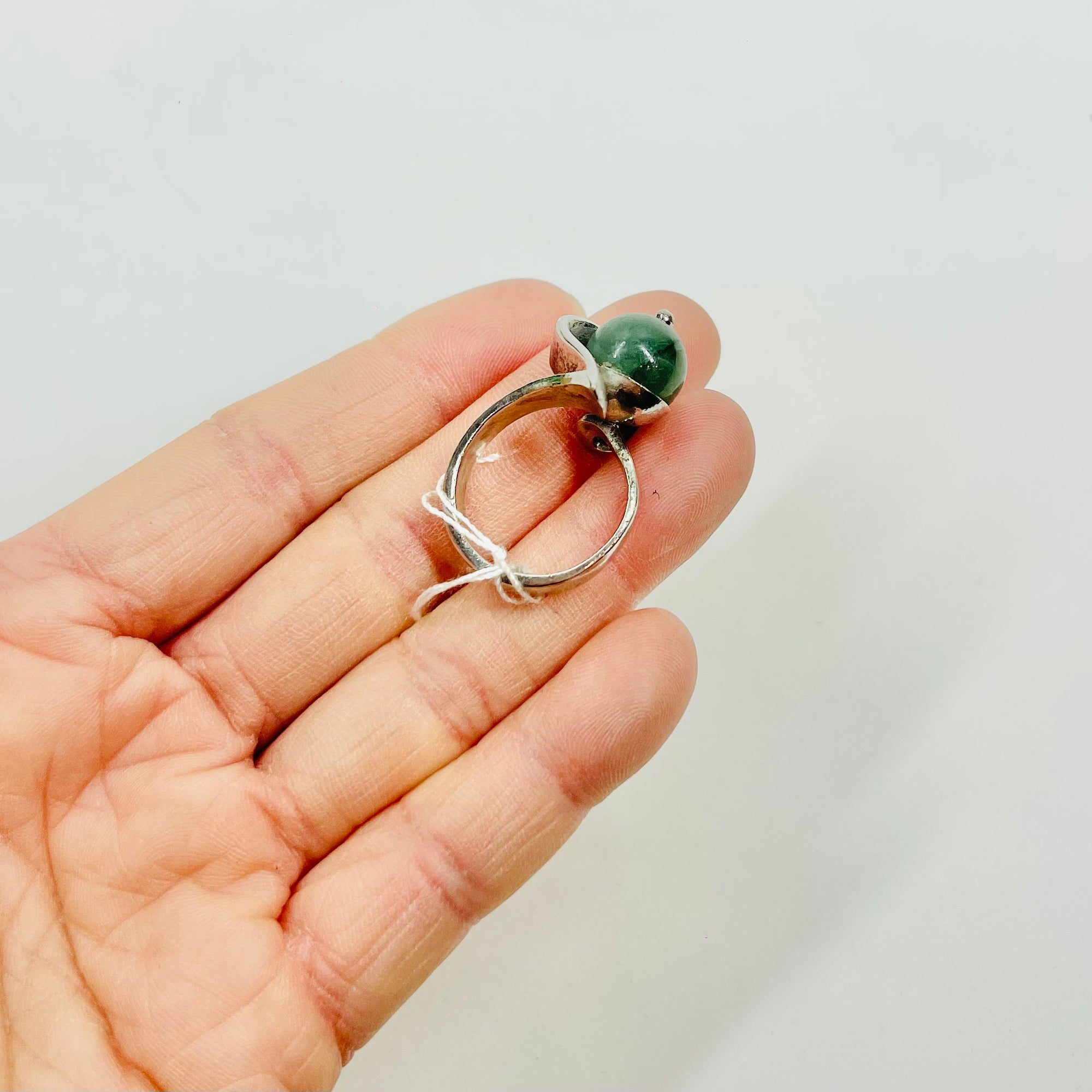 ANTIQUE SILVER RING WITH ELABORATE JADE BEAD