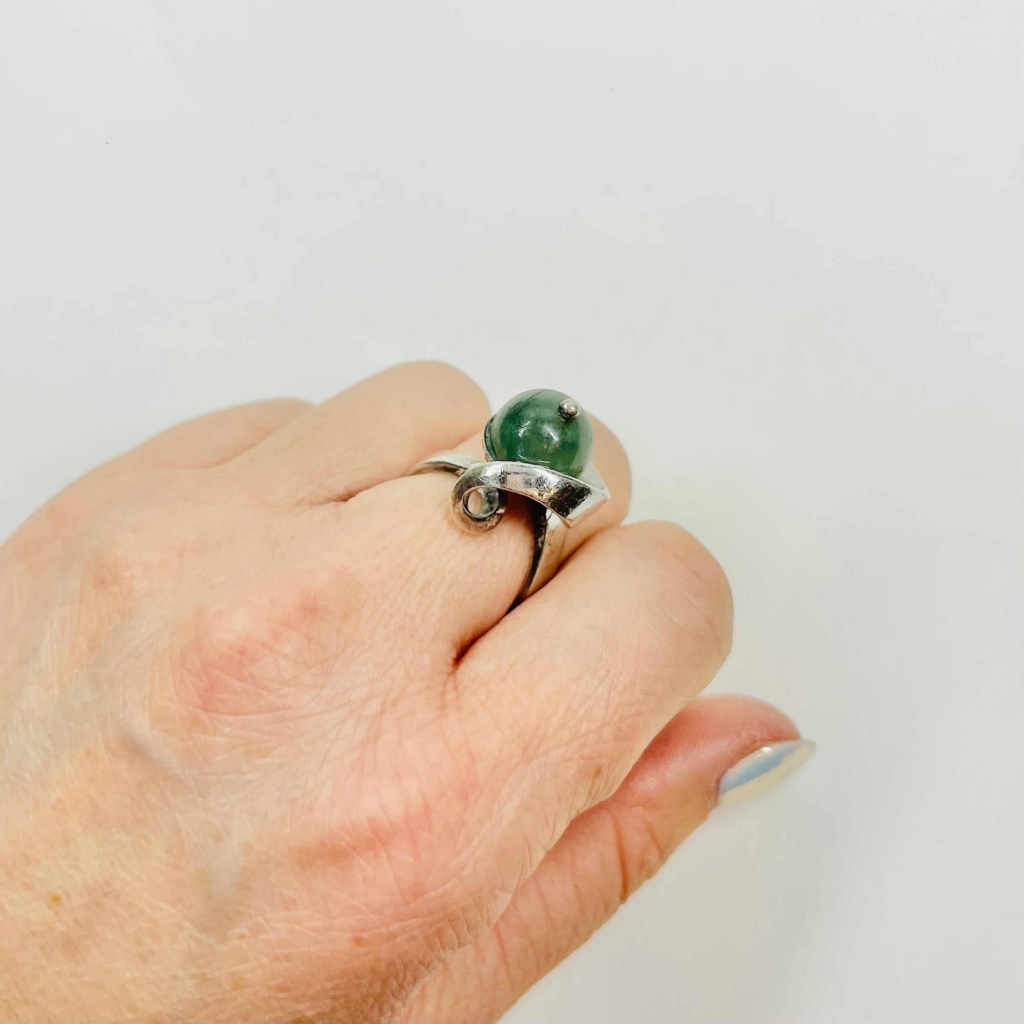 ANTIQUE SILVER RING WITH ELABORATE JADE BEAD