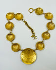 1980s CHANEL ESTRUCAN STYLE LOGO MEDALLION NECKLACE