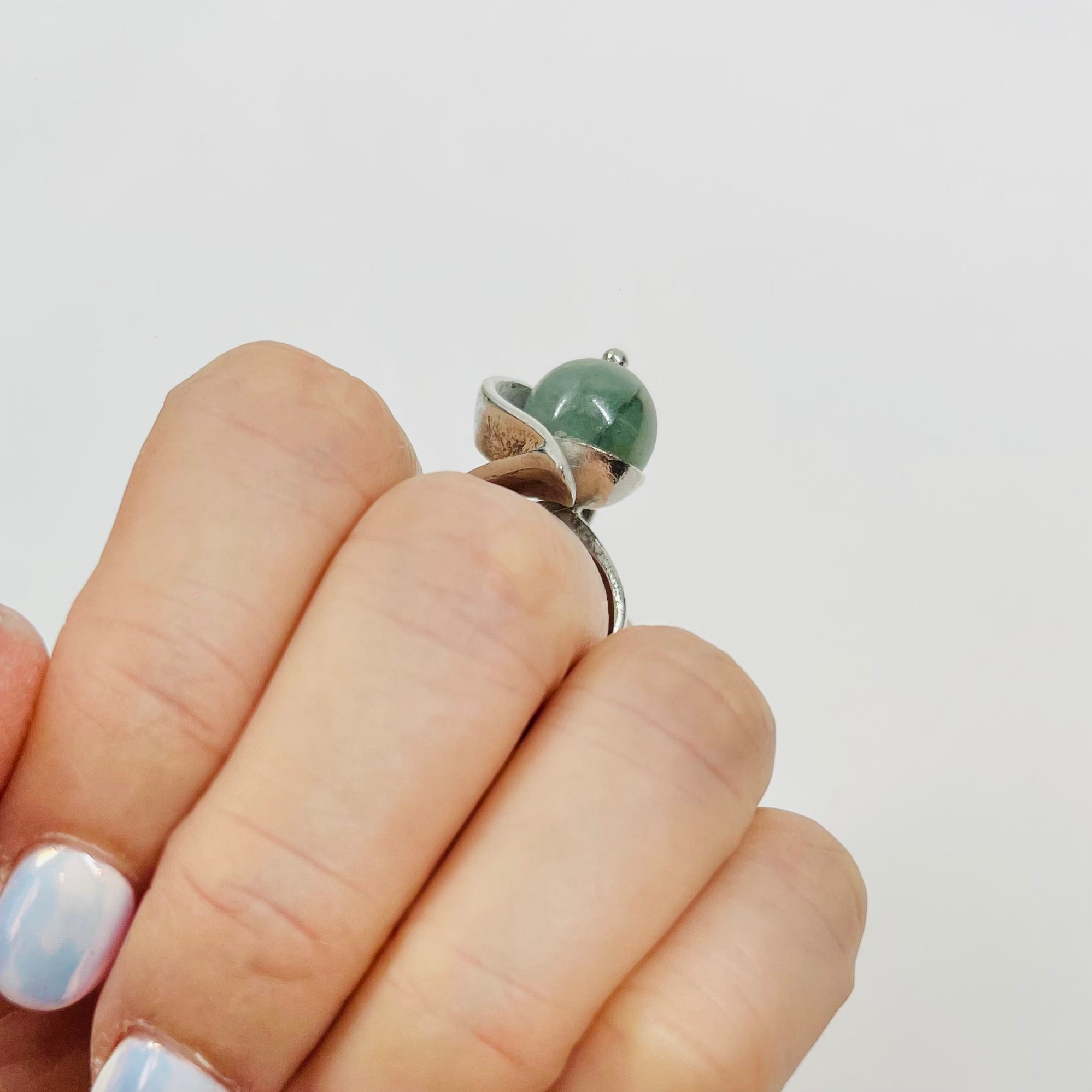 ANTIQUE SILVER RING WITH ELABORATE JADE BEAD