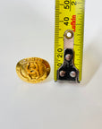 1990s CHANEL OVAL GOLD LOGO CLIP ON EARRINGS