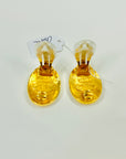 1990s CHANEL OVAL GOLD LOGO CLIP ON EARRINGS
