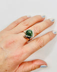 ANTIQUE SILVER RING WITH ELABORATE JADE BEAD