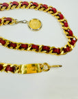 1980s CHANEL RED/BURGUNDY LEATHER GOLD PLATED LOGO BELT