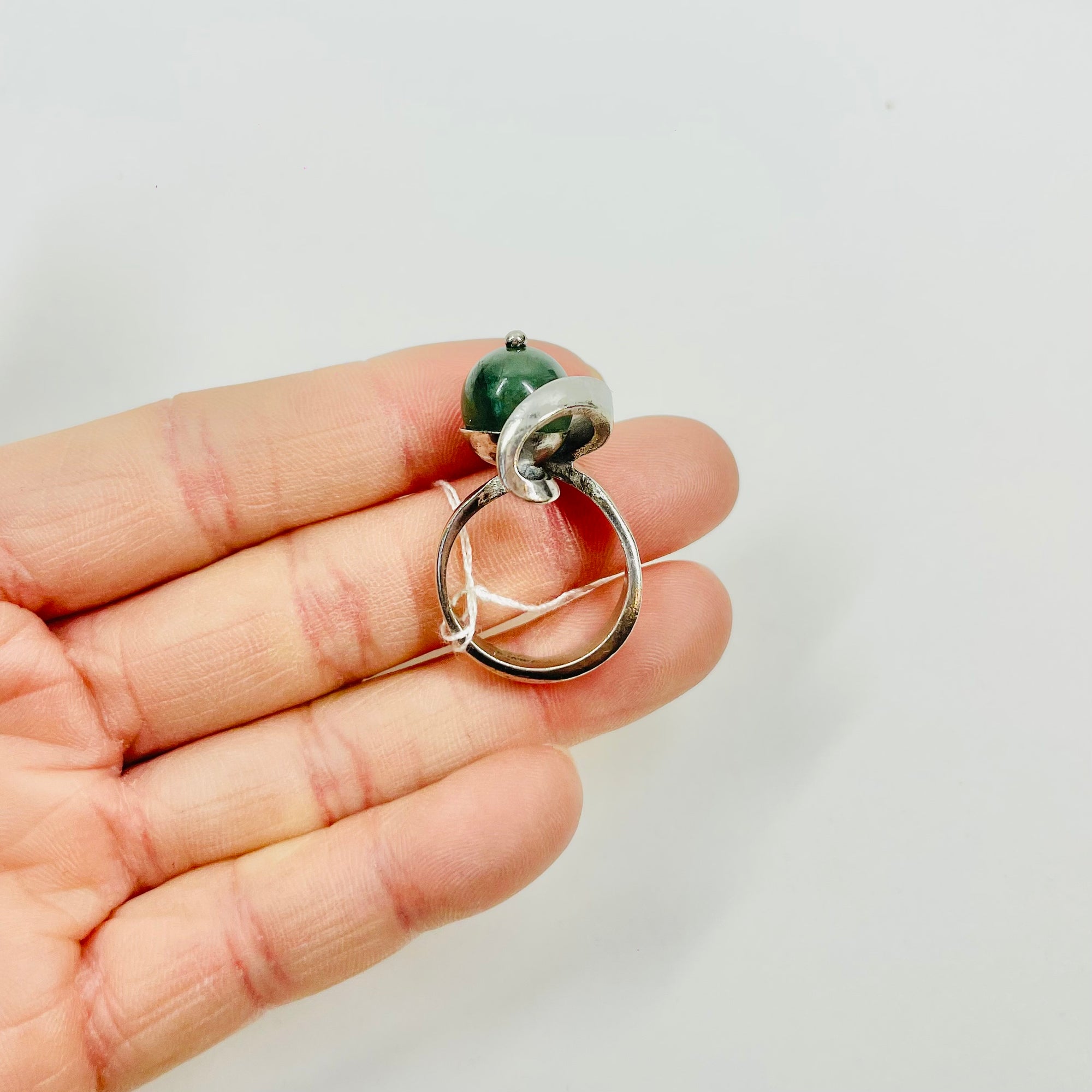 ANTIQUE SILVER RING WITH ELABORATE JADE BEAD