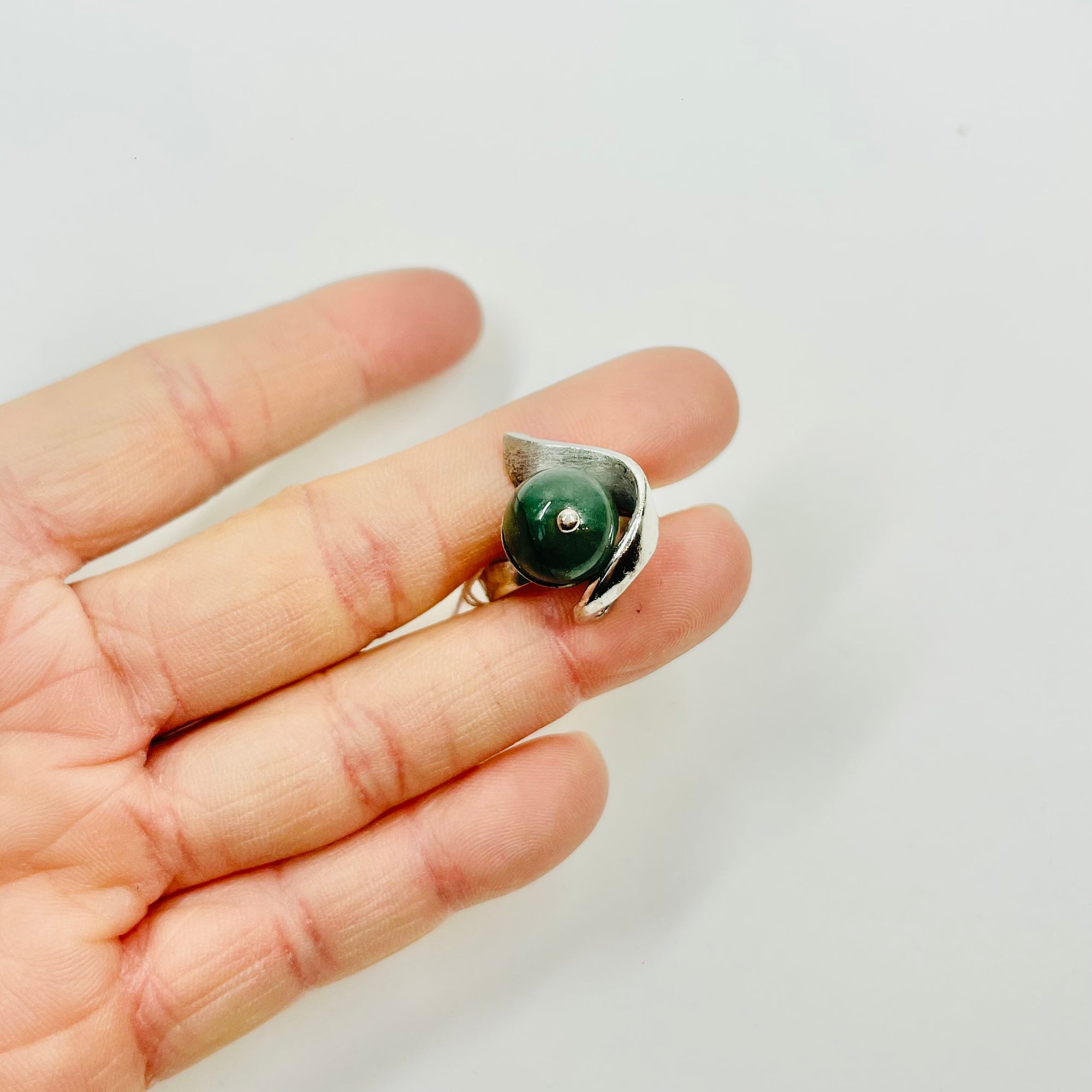 ANTIQUE SILVER RING WITH ELABORATE JADE BEAD
