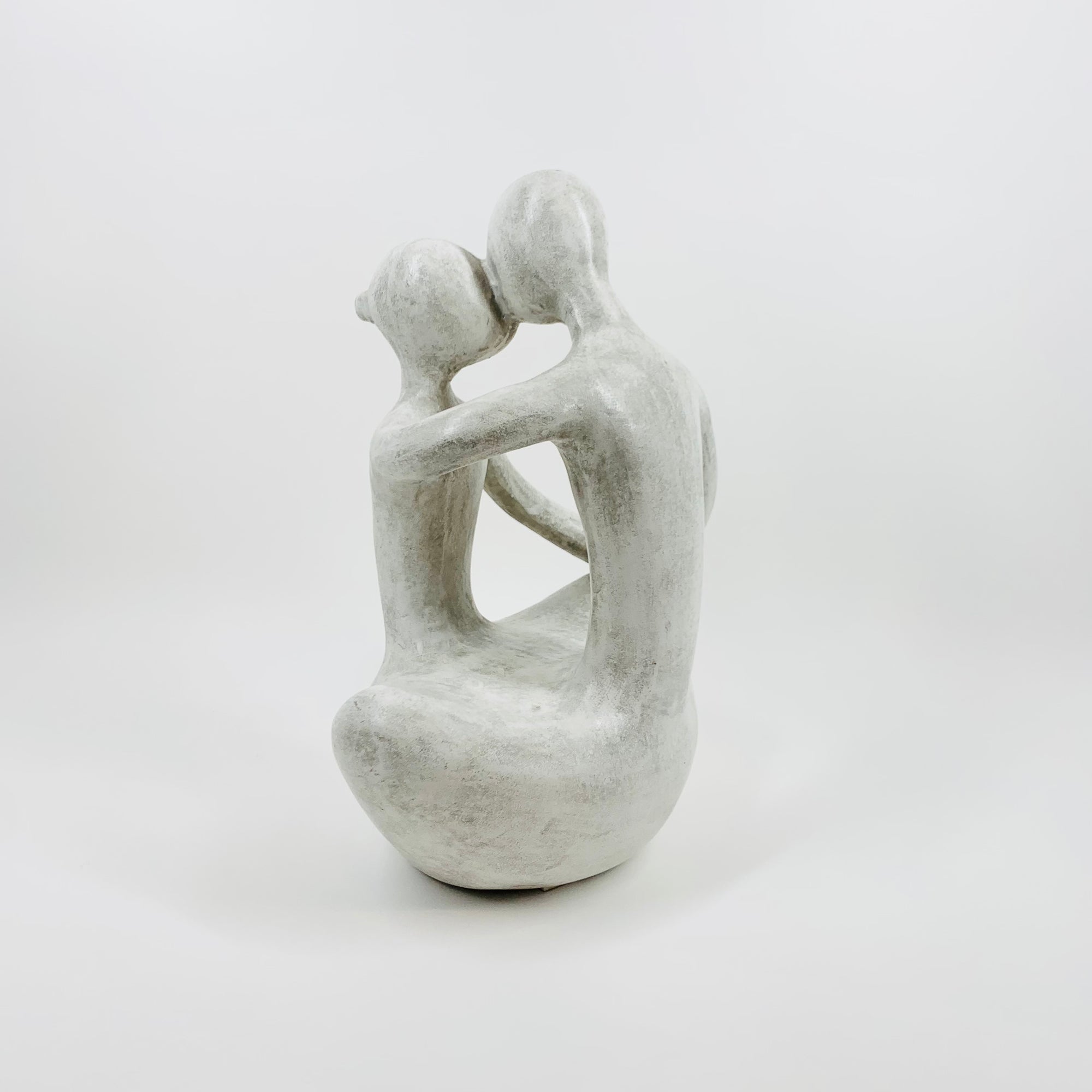 1980s COMPOSITE STONE EMBRACING COUPLE SCULPTURE
