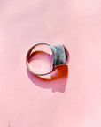 Antique sterling silver ring with purple glass paste solitaire stone