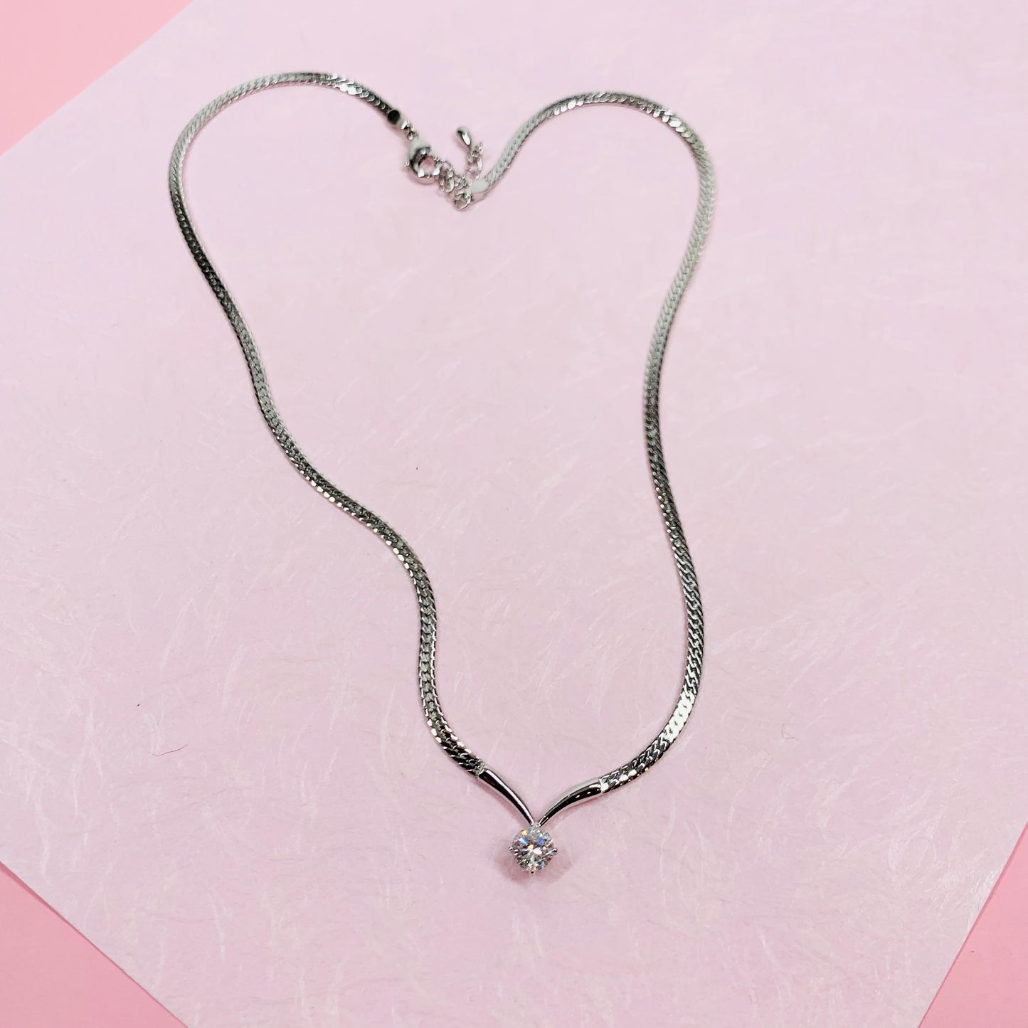 1980s Avon costume silver plated necklace with solitaire chevron pendant