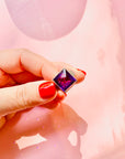 Antique sterling silver ring with purple glass paste solitaire stone