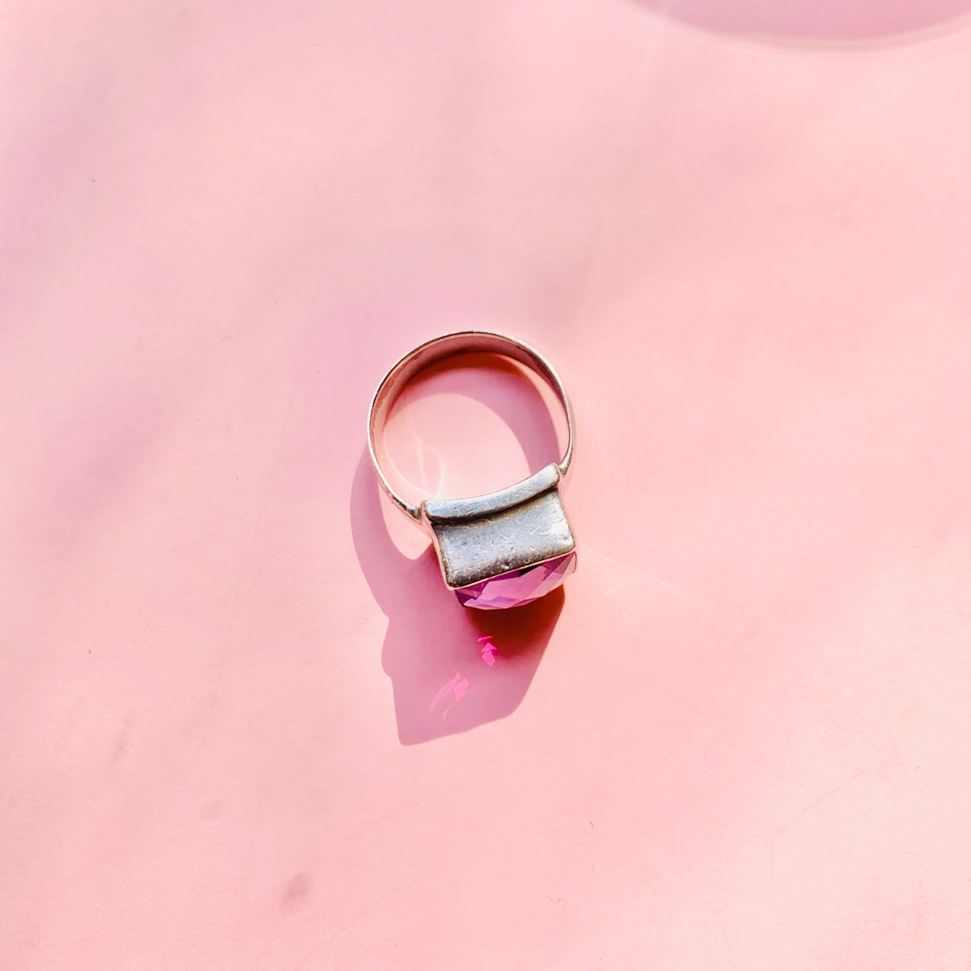 Antique sterling silver ring with purple glass paste solitaire stone