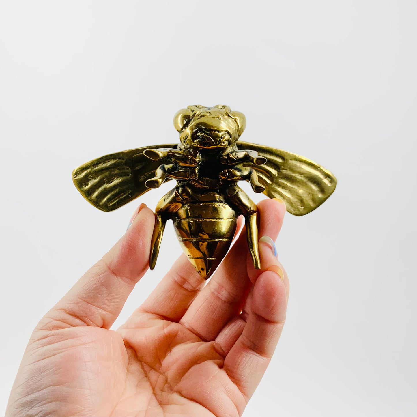 Antique brass bee