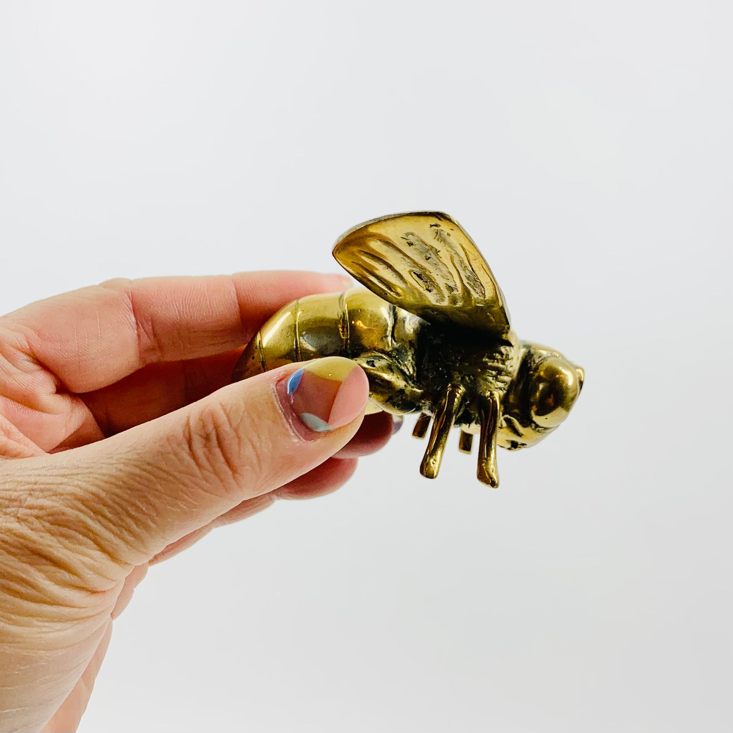 Antique brass bee