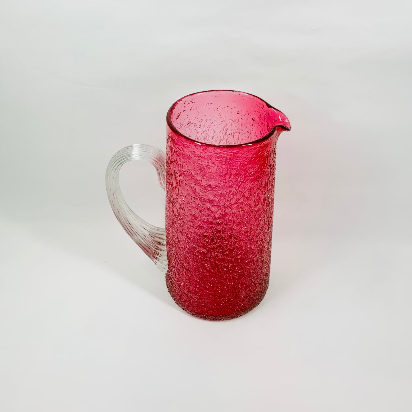 Antique Victorian cranberry crackle glass jug with clear handle
