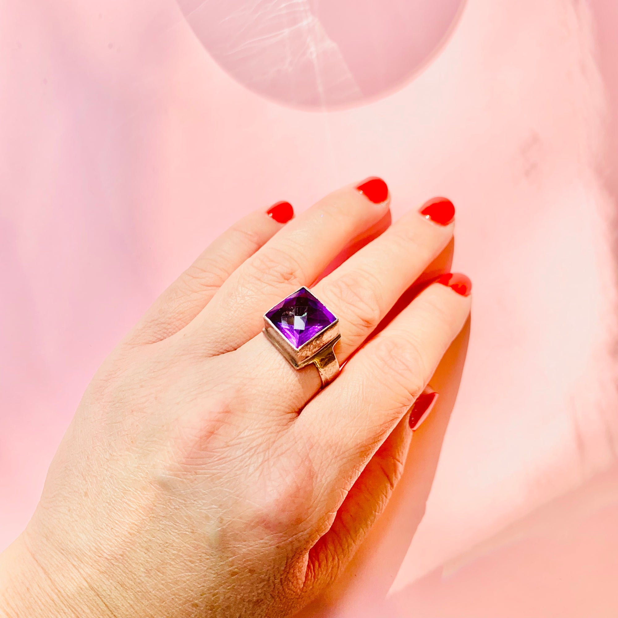 Antique sterling silver ring with purple glass paste solitaire stone