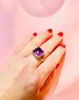 Antique sterling silver ring with purple glass paste solitaire stone