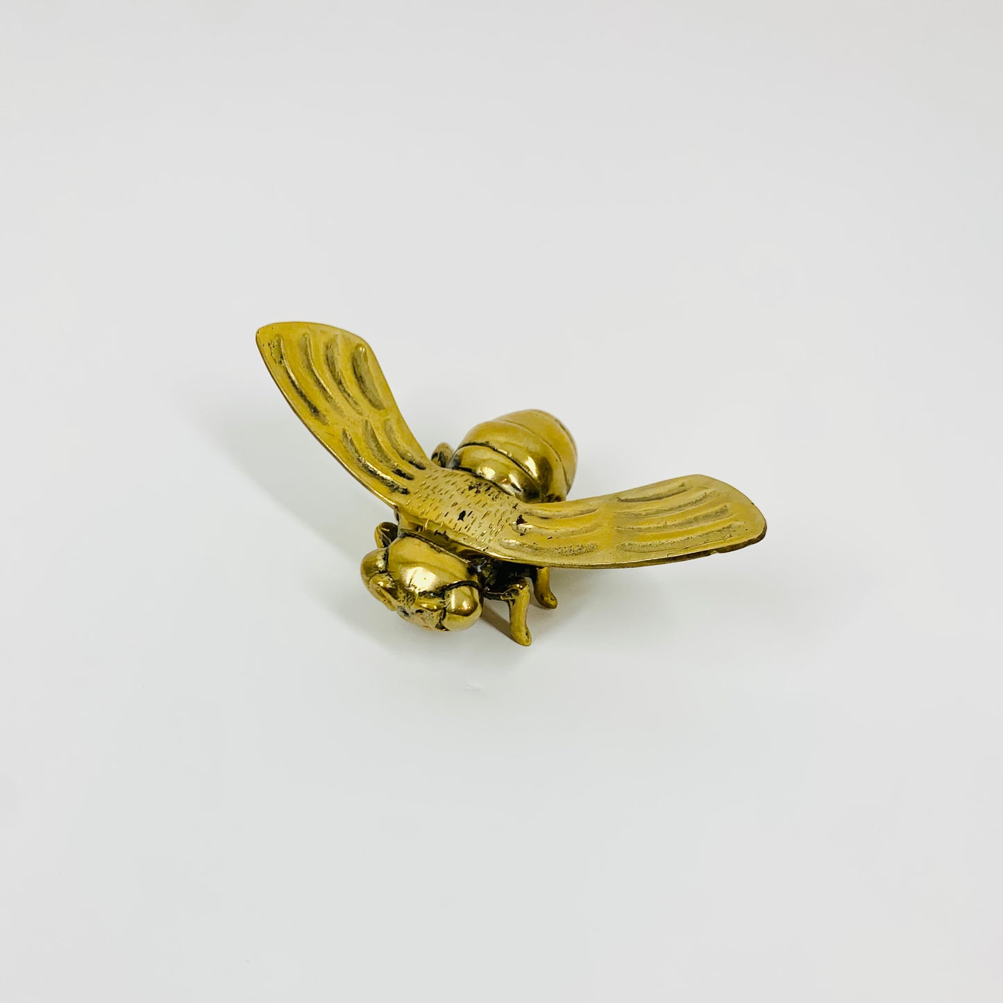 Antique brass bee