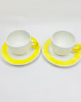 1980s hand painted Italian white porcelain coffee cup and matching saucer with yellow rim