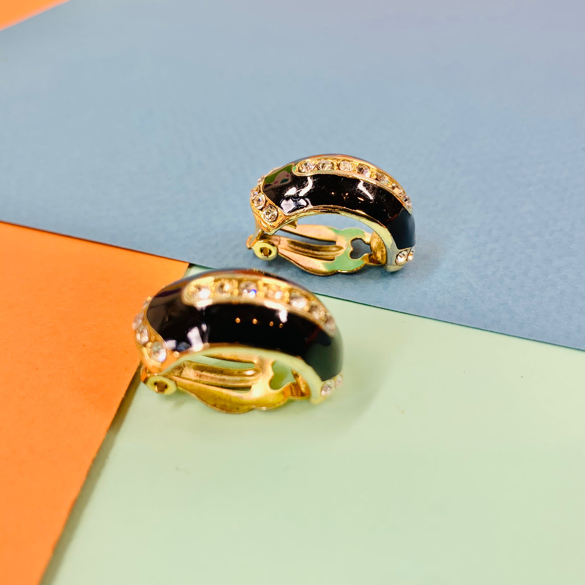 Stunning 1960s gold plated clip on black enamel earrings with rhinestones