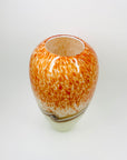 Vintage hand made orange cased art glass vase with abstract pattern