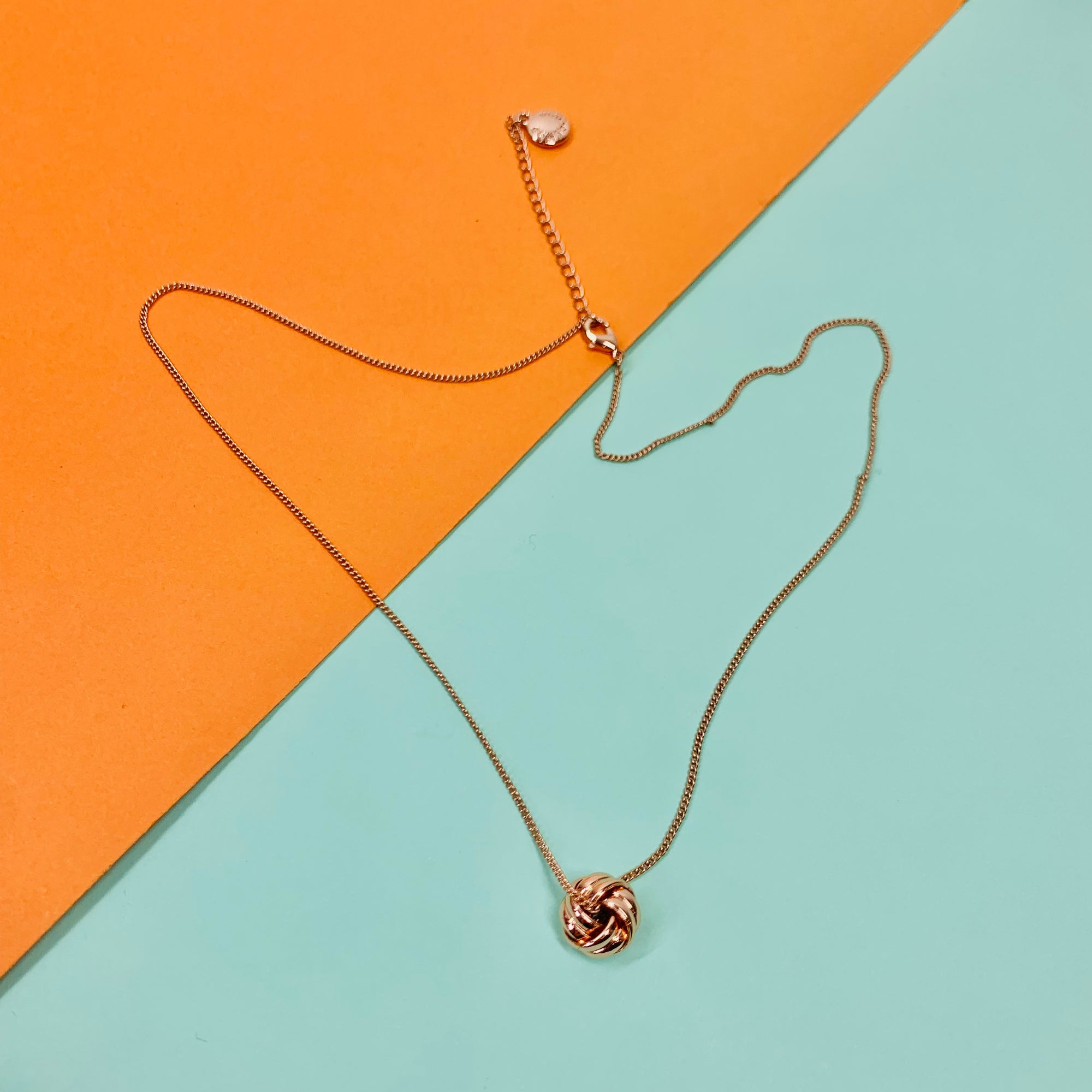 Vintage rose gold plated necklace with knot ball pendant