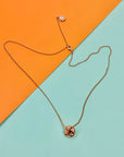 Vintage rose gold plated necklace with knot ball pendant
