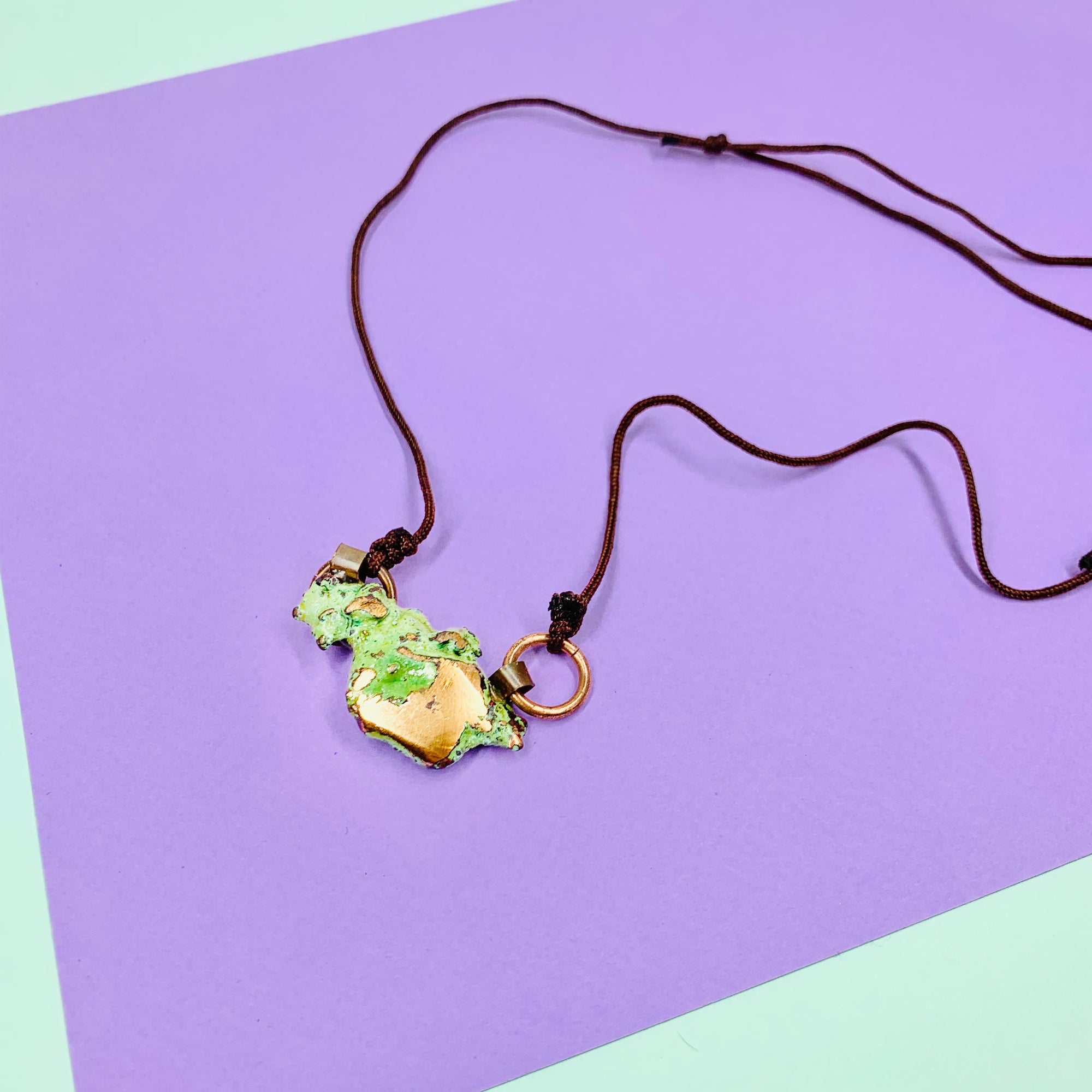 Hand made raw copper nugget pendant on brown cord