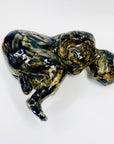 Australian pottery sculpture depicting woman clutching her stomach