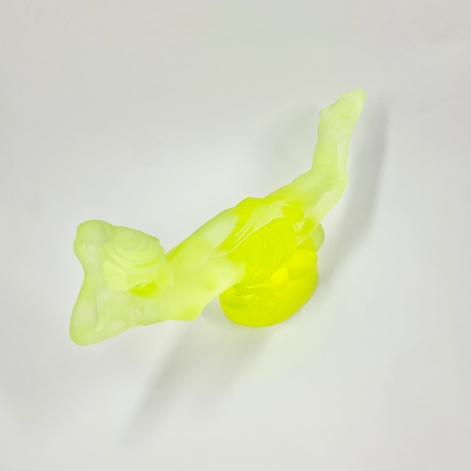 Art Deco reproduction of Lalique lie down Nude with star bangle cape figurine in uranium glass
