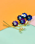 1970s gold plated flower bouquet brooch with iridescent purple Swarovski crystal flowers