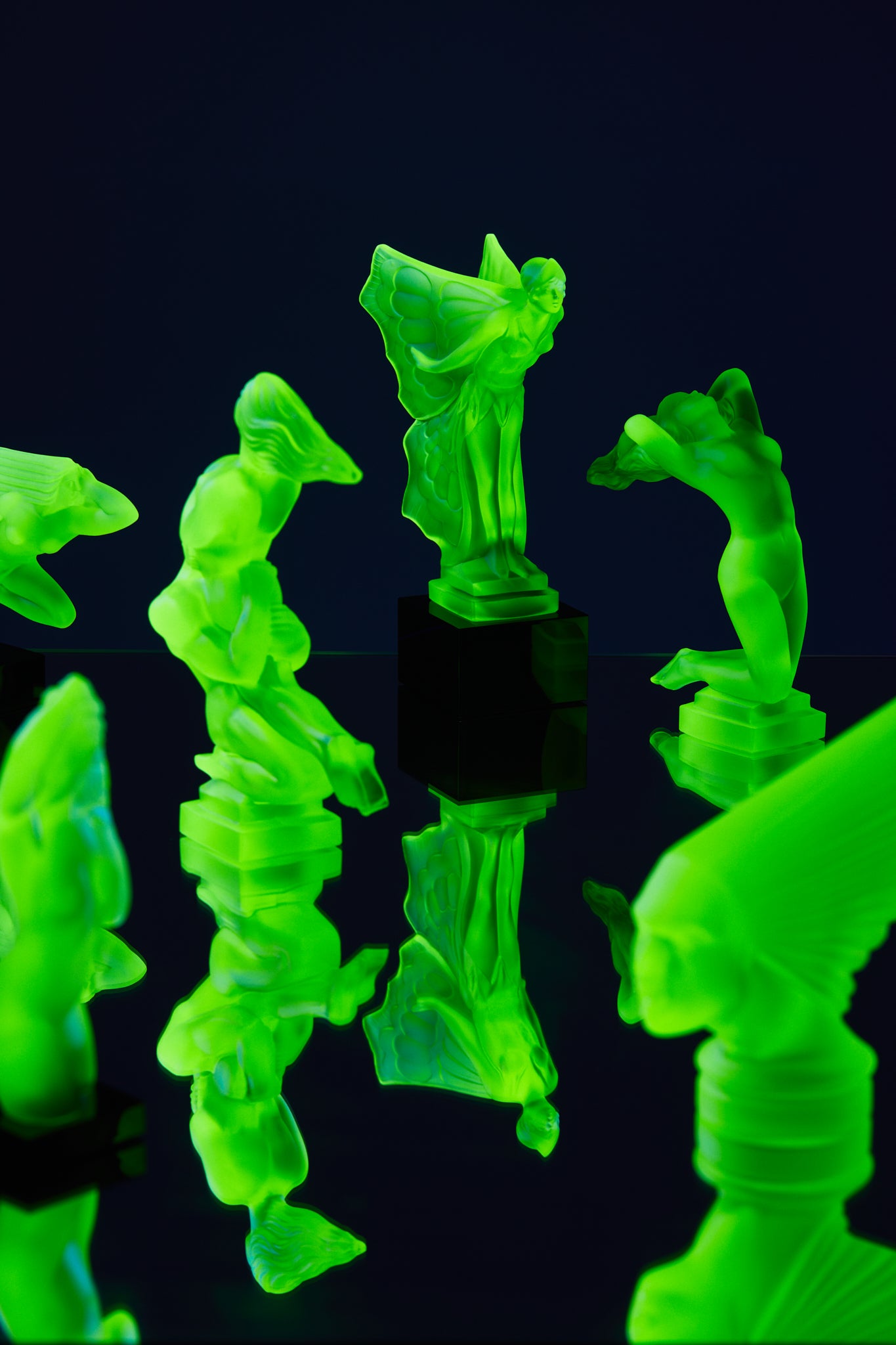 Art Deco reproduction of Lalique Nude with star bangle cape figurine in uranium glass