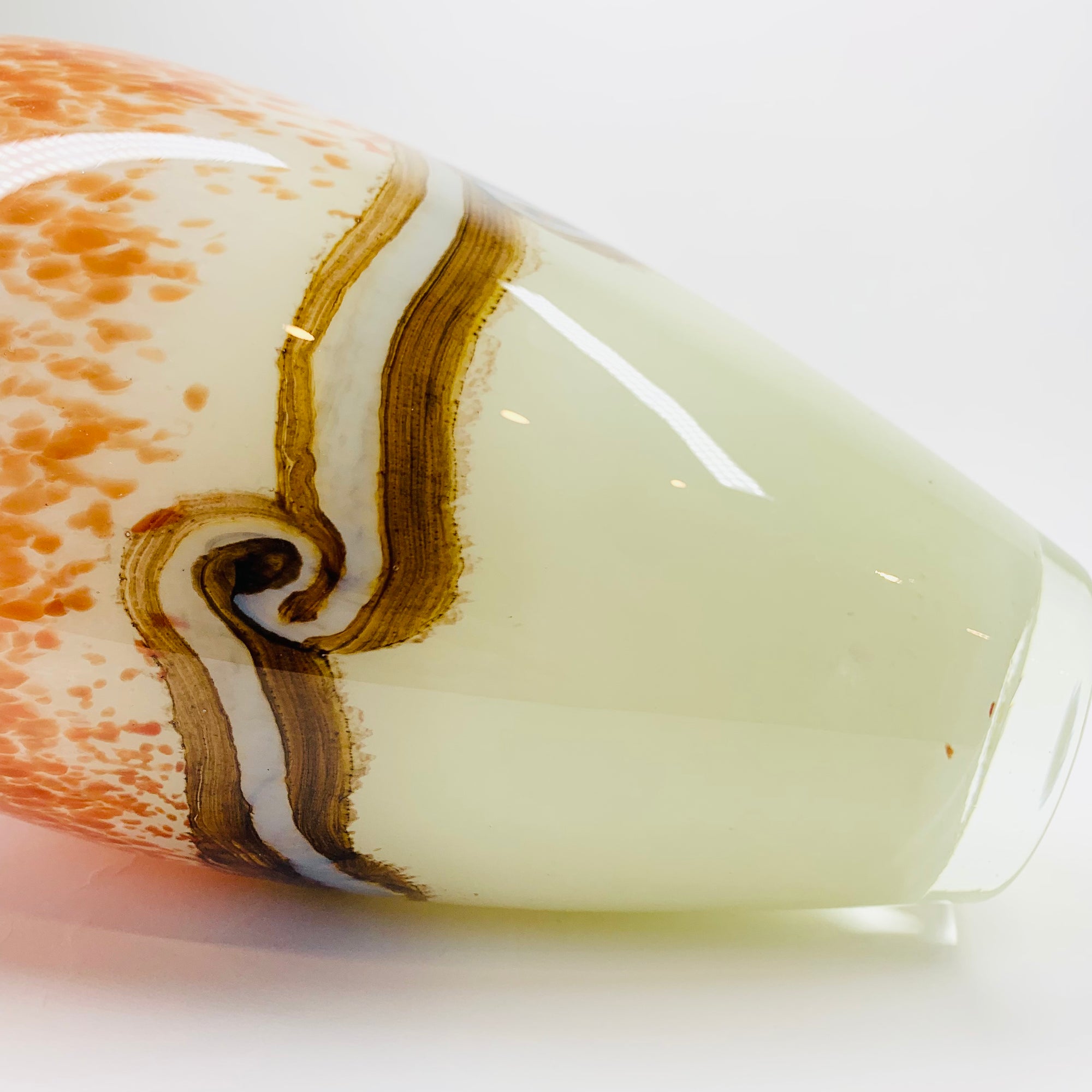 Vintage hand made orange cased art glass vase with abstract pattern