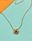 Vintage rose gold plated necklace with knot ball pendant