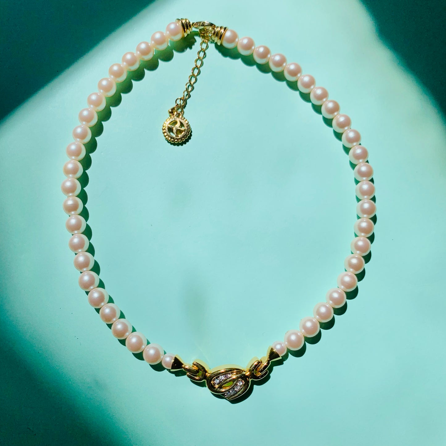1960s Avon costume pearl necklace with infinity pendant