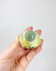 Antique Chinese hand painted yellow porcelain snuff bottle with jade stopper