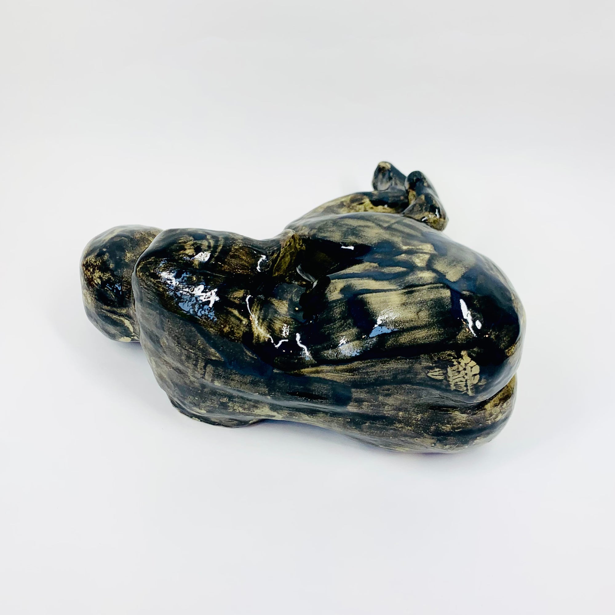 Australian pottery sculpture depicting woman clutching her stomach