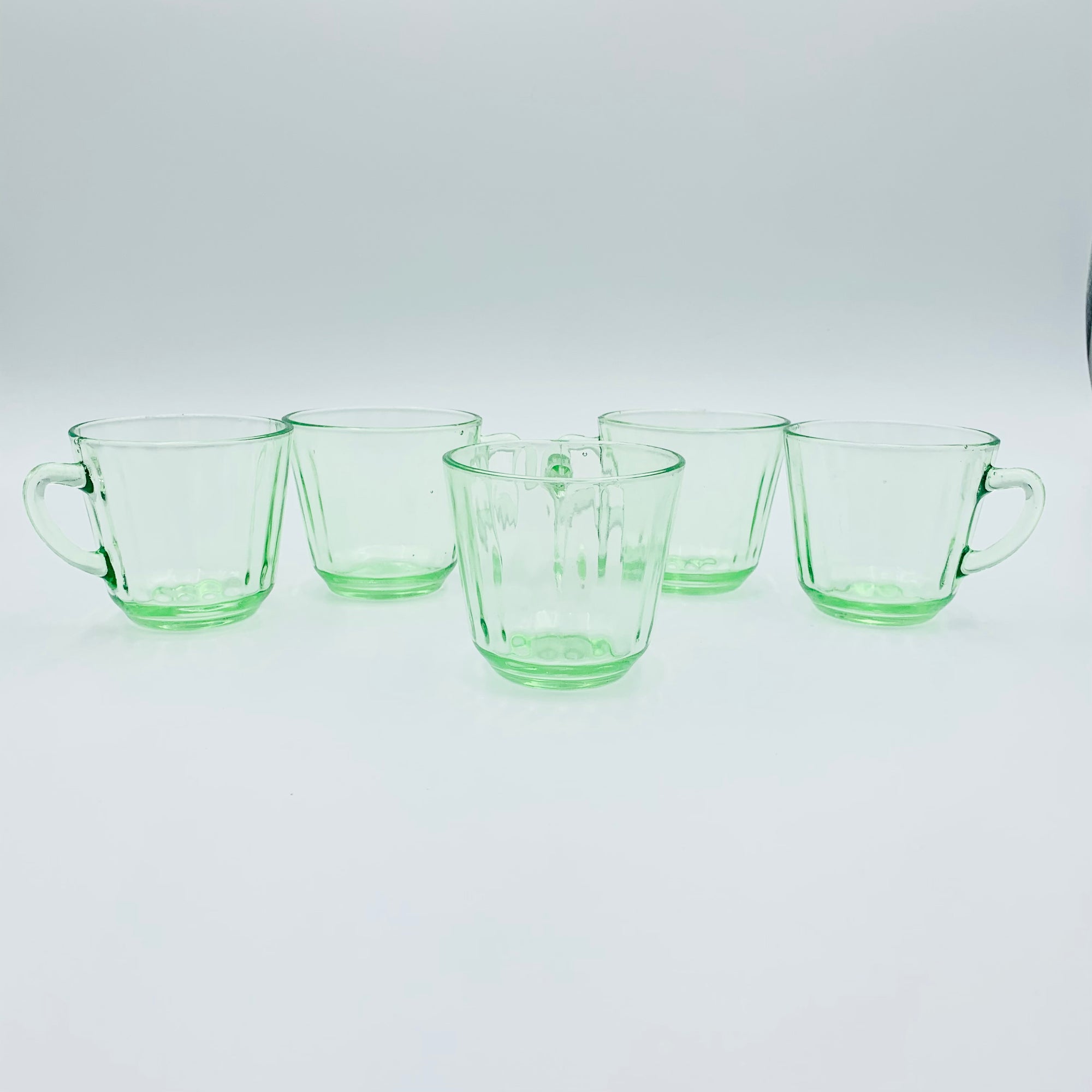 Extremely rare antique Art Deco green glass tea cup and matching saucer