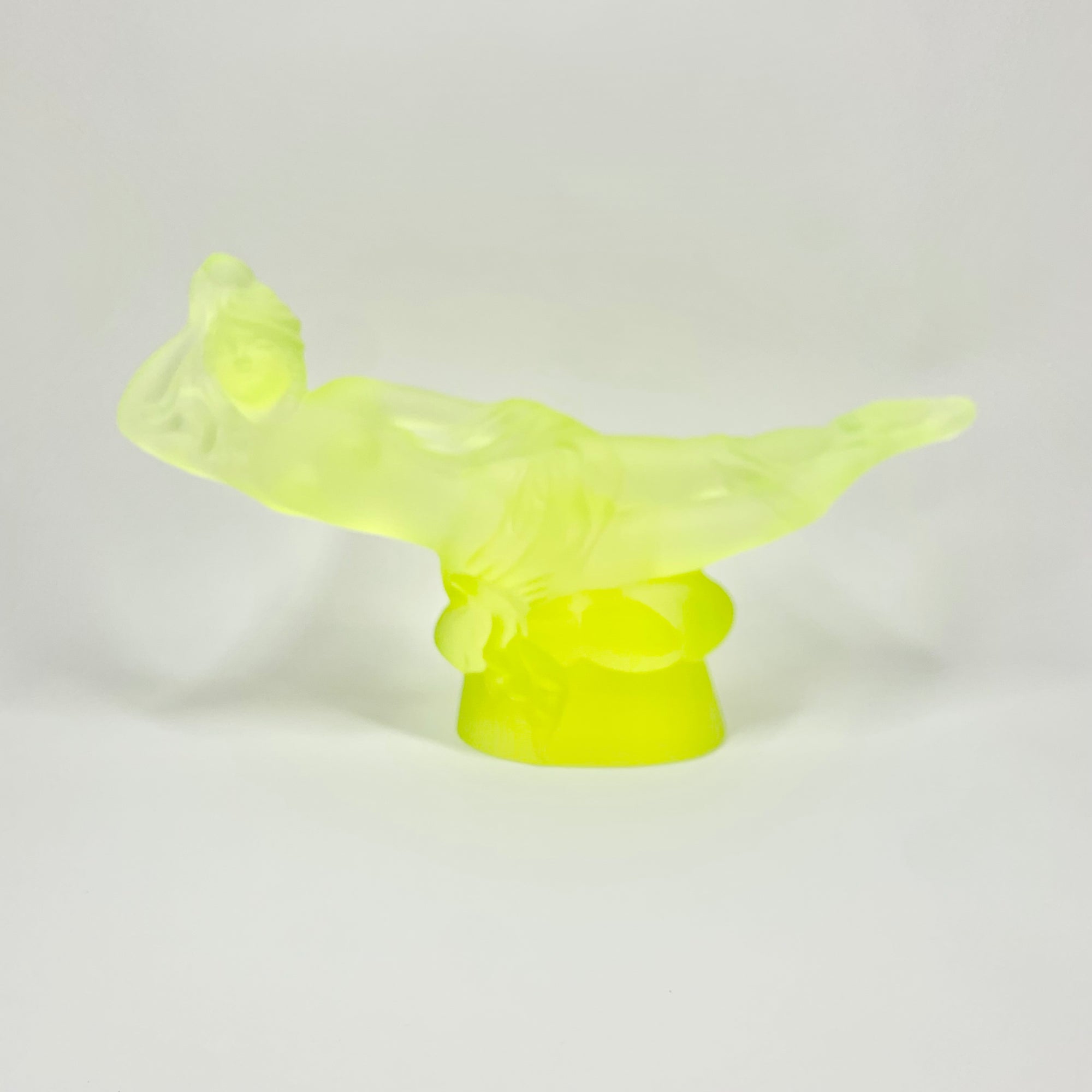 Art Deco reproduction of Lalique lie down Nude with star bangle cape figurine in uranium glass