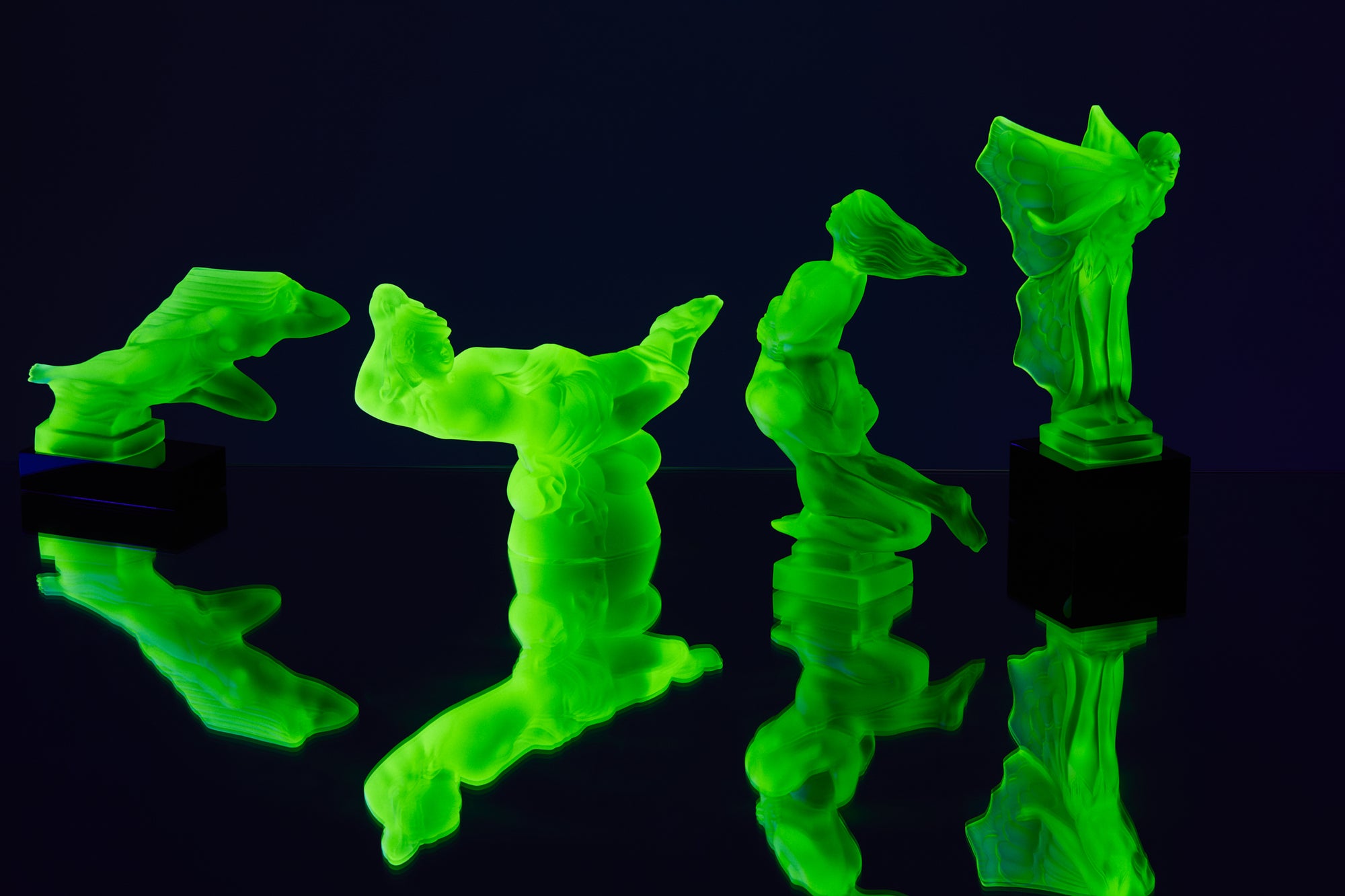 Art Deco reproduction of Lalique lie down Nude with star bangle cape figurine in uranium glass