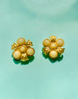 Rare 1980s matte triple gold plated gold matte pearl flower clip on earrings by Monet
