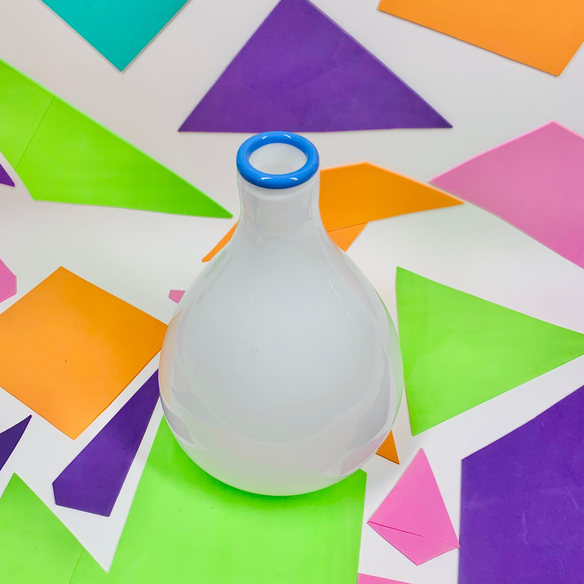 1980s cased white bottle vase with blue rim