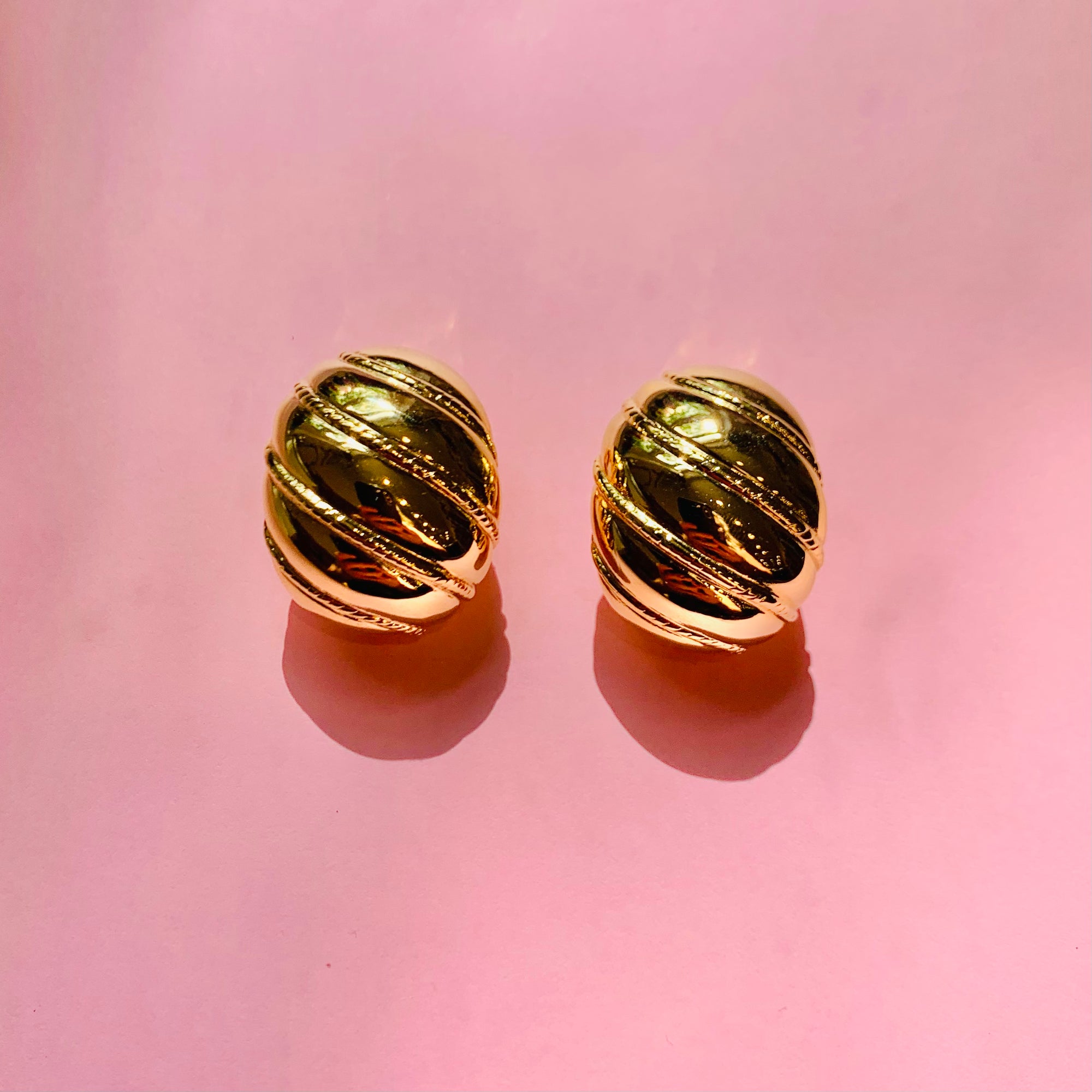 1960s Barcs triple gold plated ribbed cocoon clip on earrings by Monet