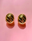1960s Barcs triple gold plated ribbed cocoon clip on earrings by Monet
