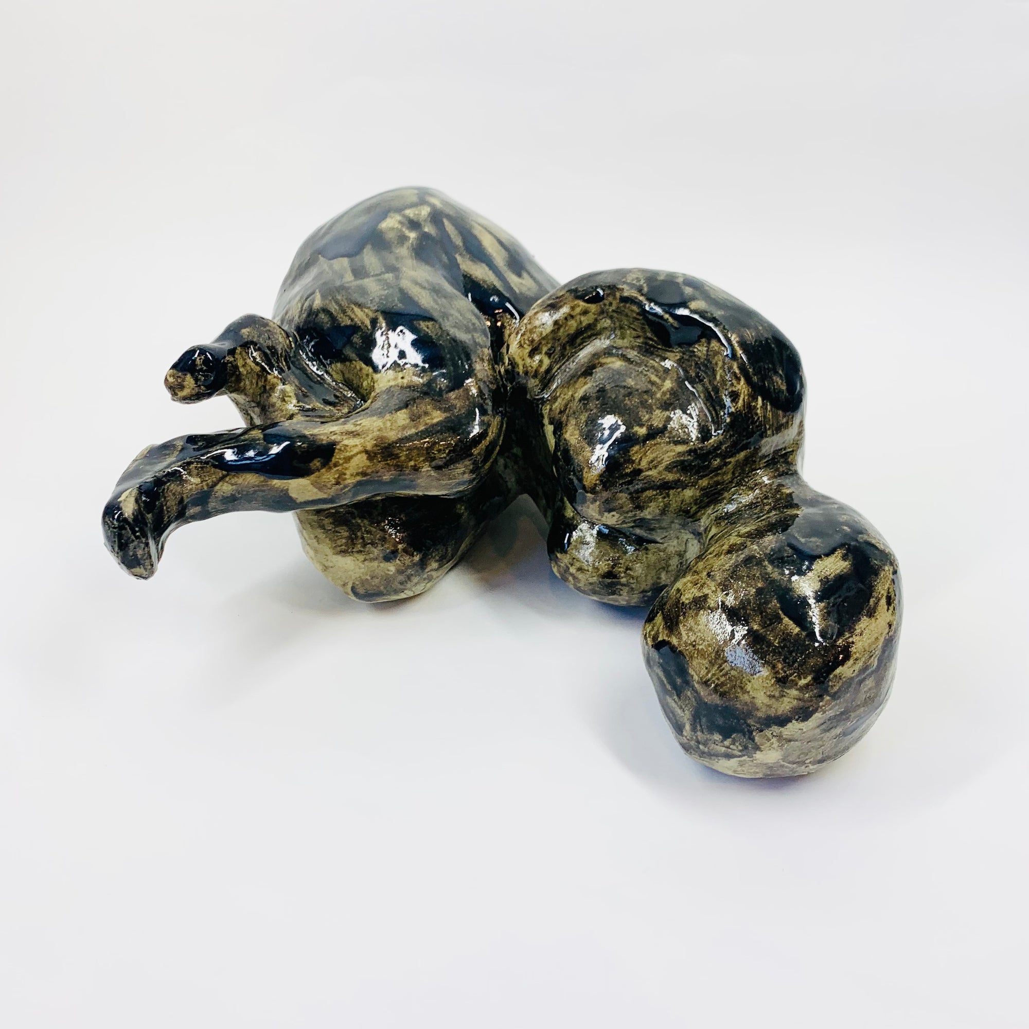 Australian pottery sculpture depicting woman clutching her stomach