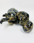 Australian pottery sculpture depicting woman clutching her stomach