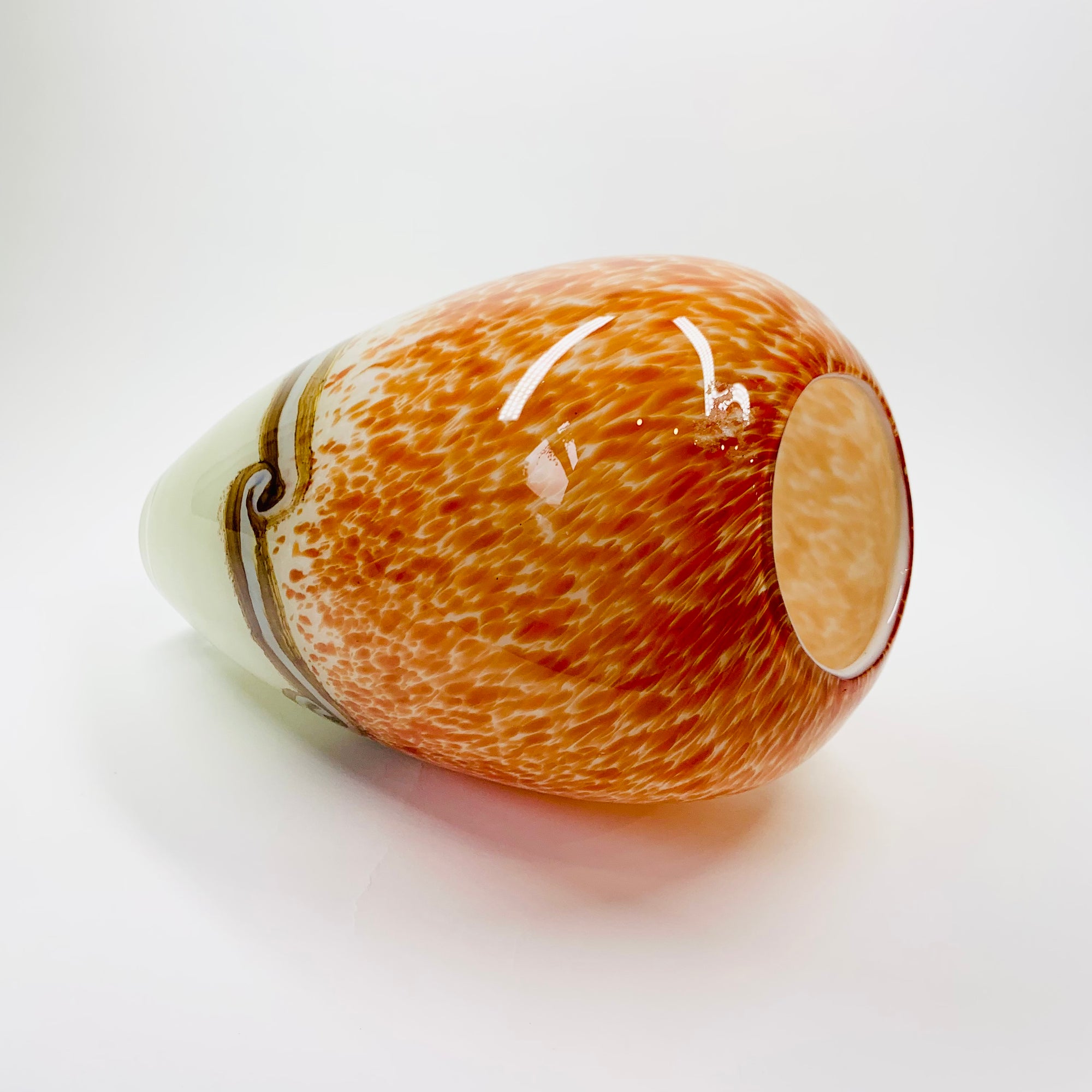 Vintage hand made orange cased art glass vase with abstract pattern